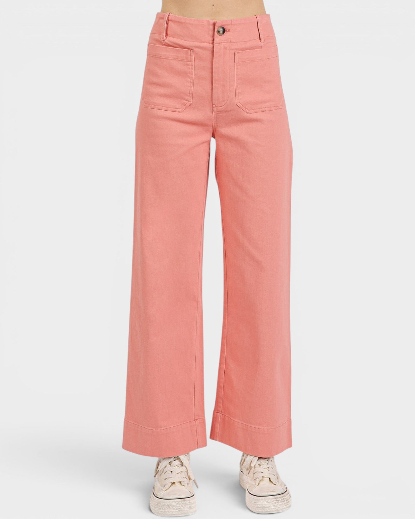 Pink wide-leg pants worn by a person on a white background
