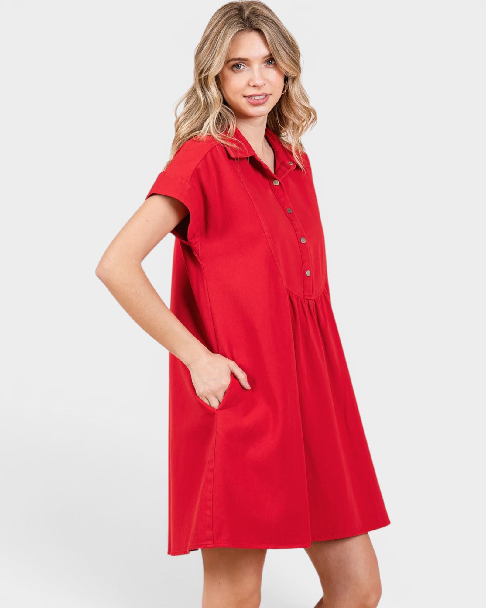 Woman wearing a red dress on a white background