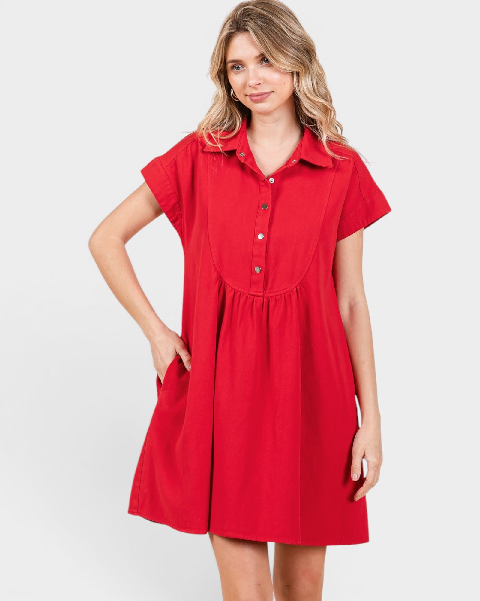 Woman wearing a red dress with a white background
