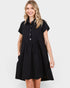 Woman wearing a black dress with buttons on a white background