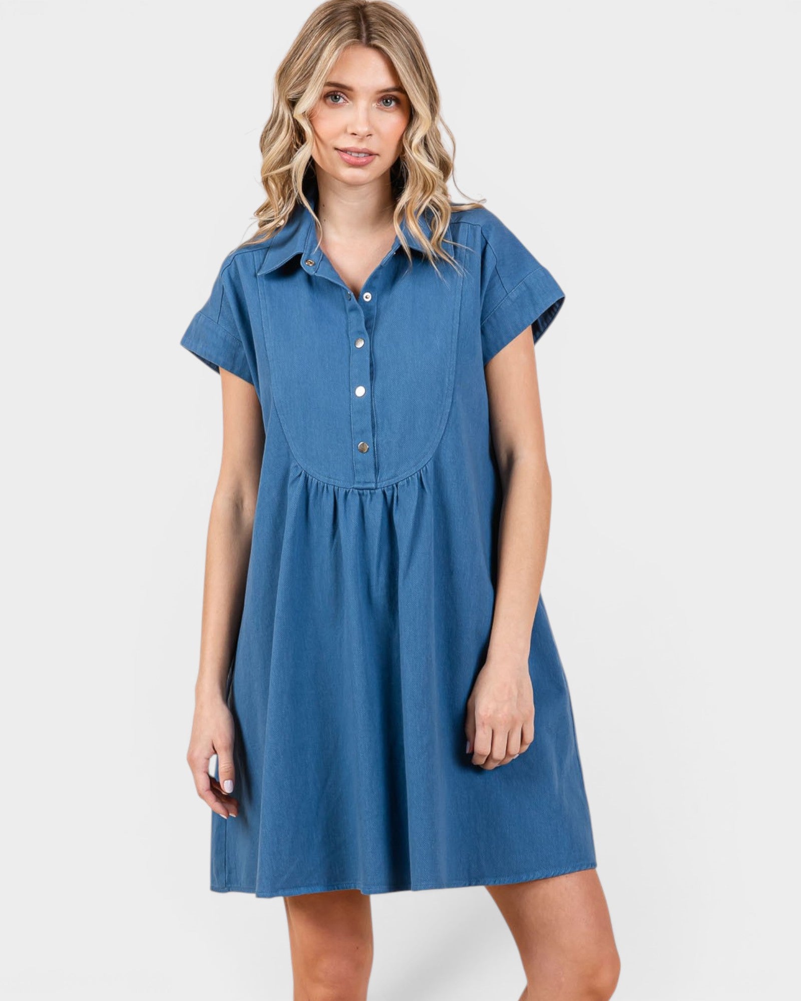 Woman wearing a blue dress on a white background