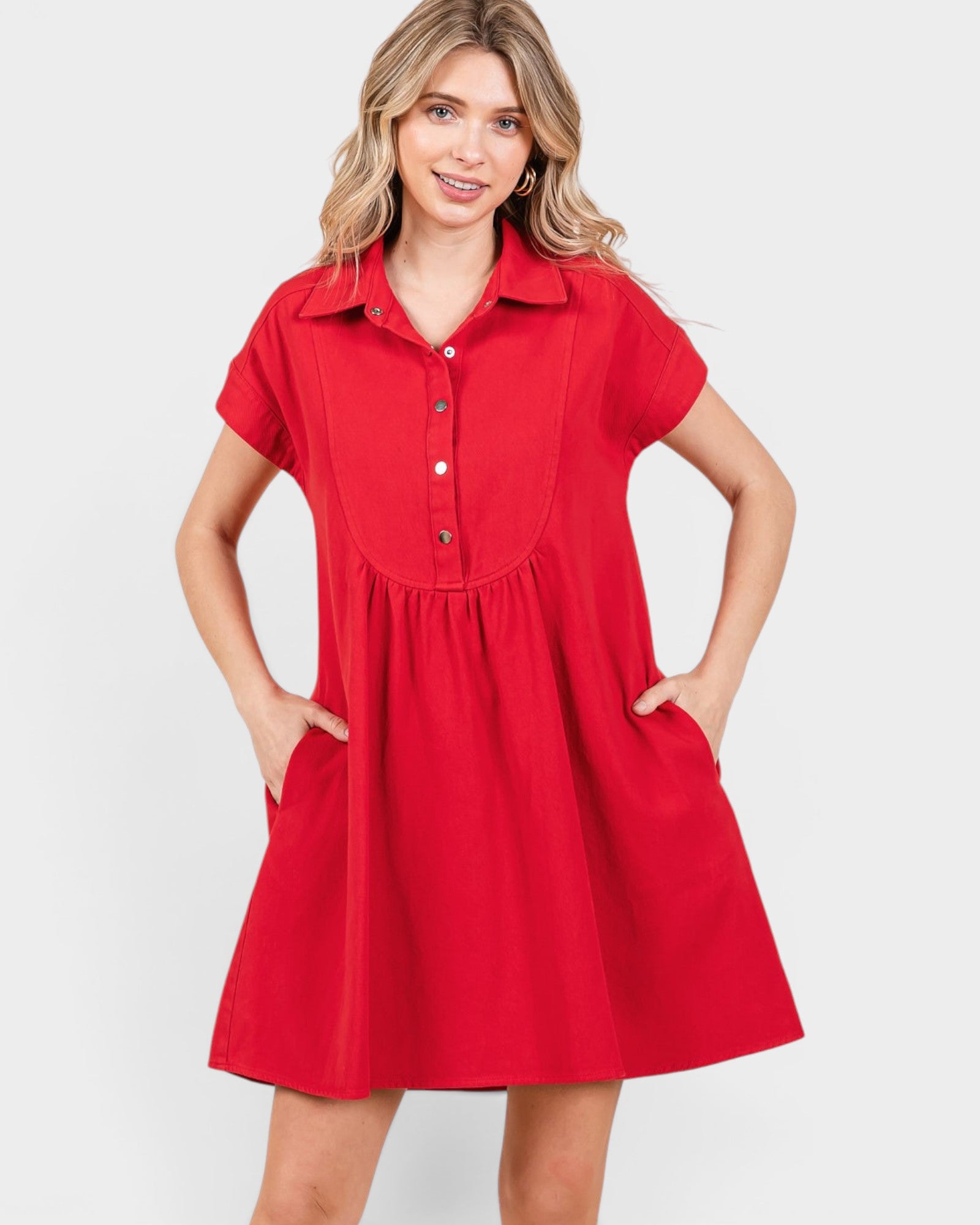Woman wearing a red dress with a white background