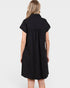 Black dress worn by a person on a white background