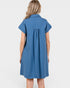 Woman wearing a blue dress against a white background