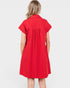 Red dress worn by a person on a white background