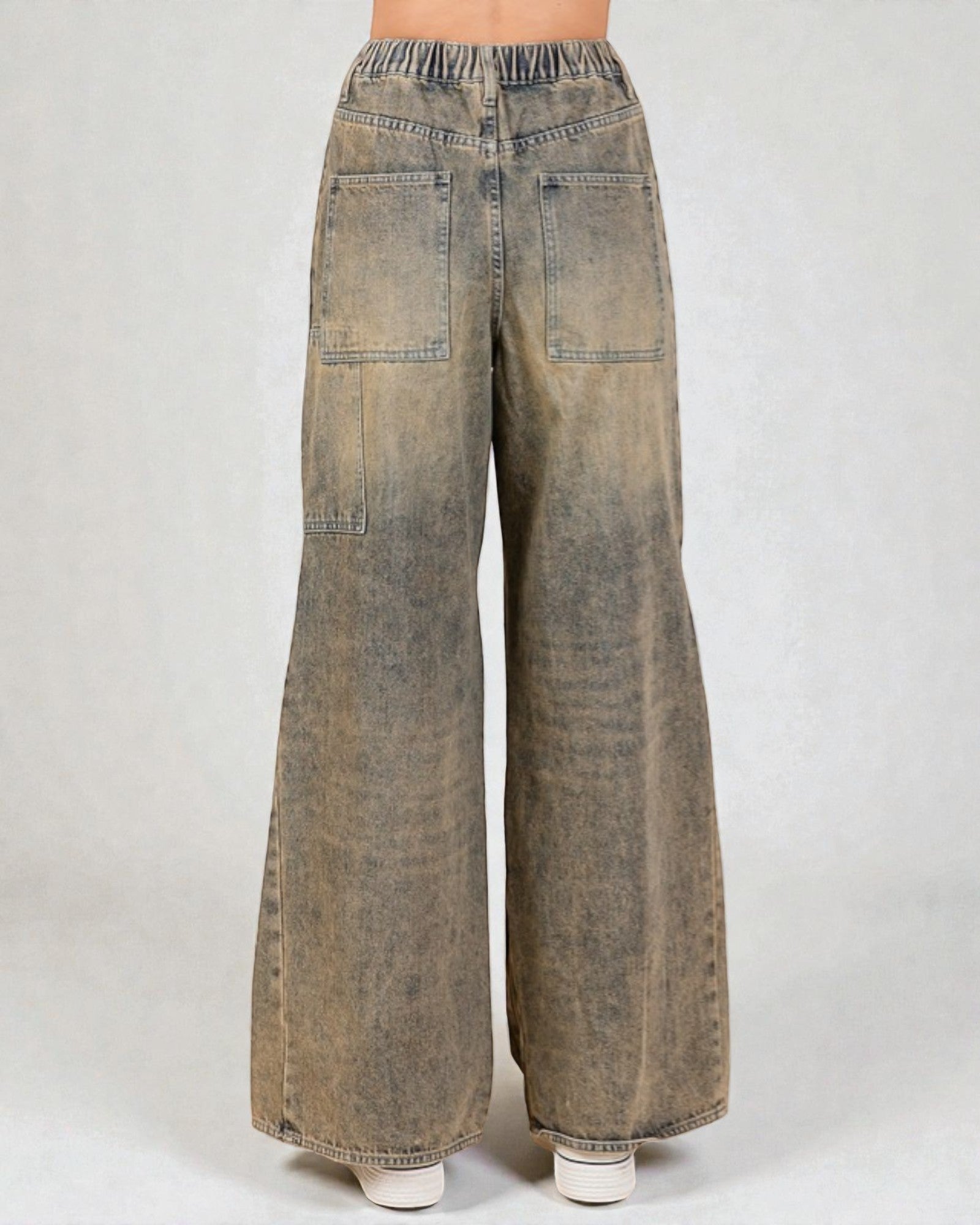 Wide-leg jeans on a plain background