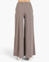 A pair of wide-leg, high-waisted pants in a muted taupe-brown color, shown on a model from the waist down against a clean white background.
