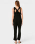 Black jumpsuit with open back on a white background