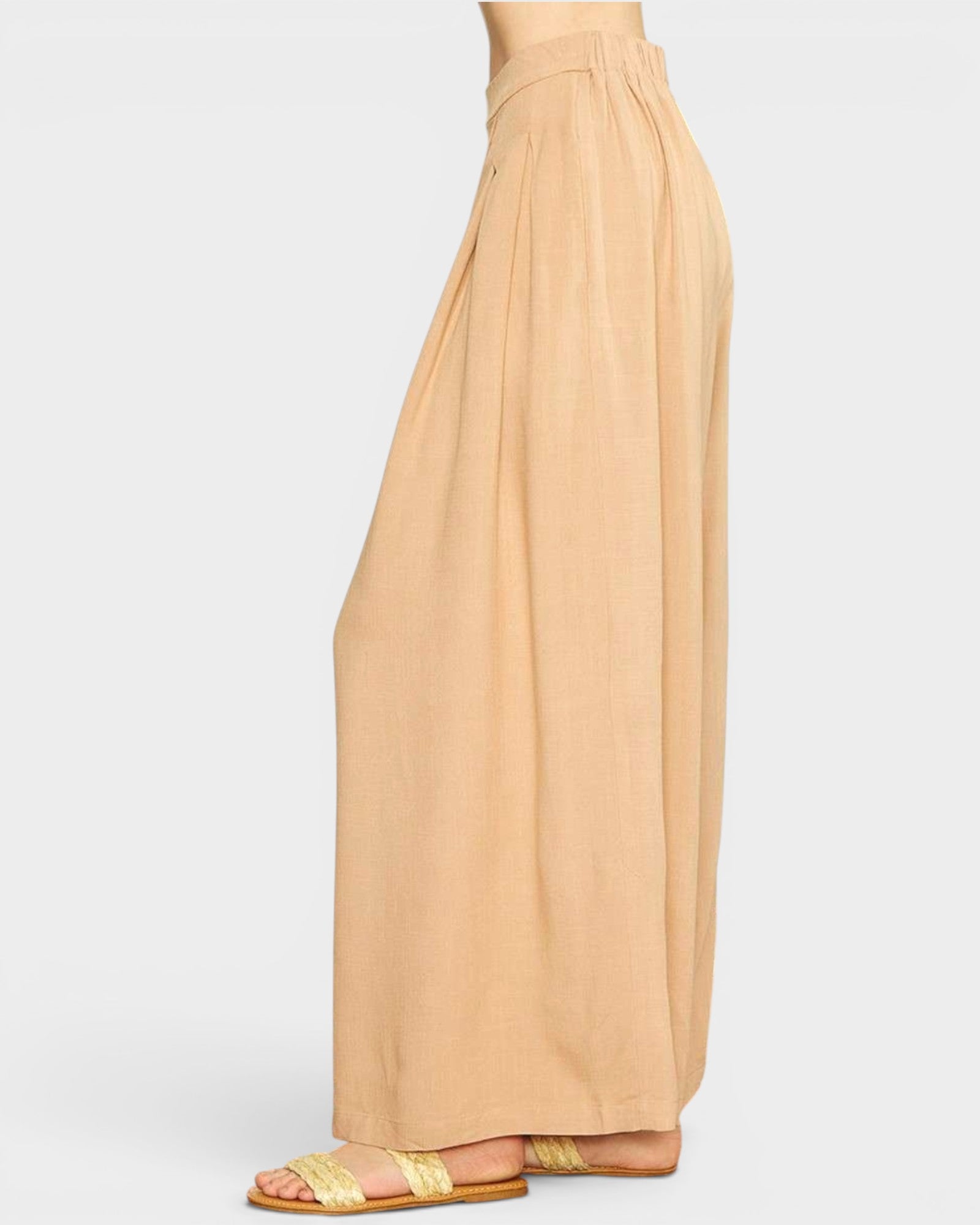Beige wide-leg pants on a white background