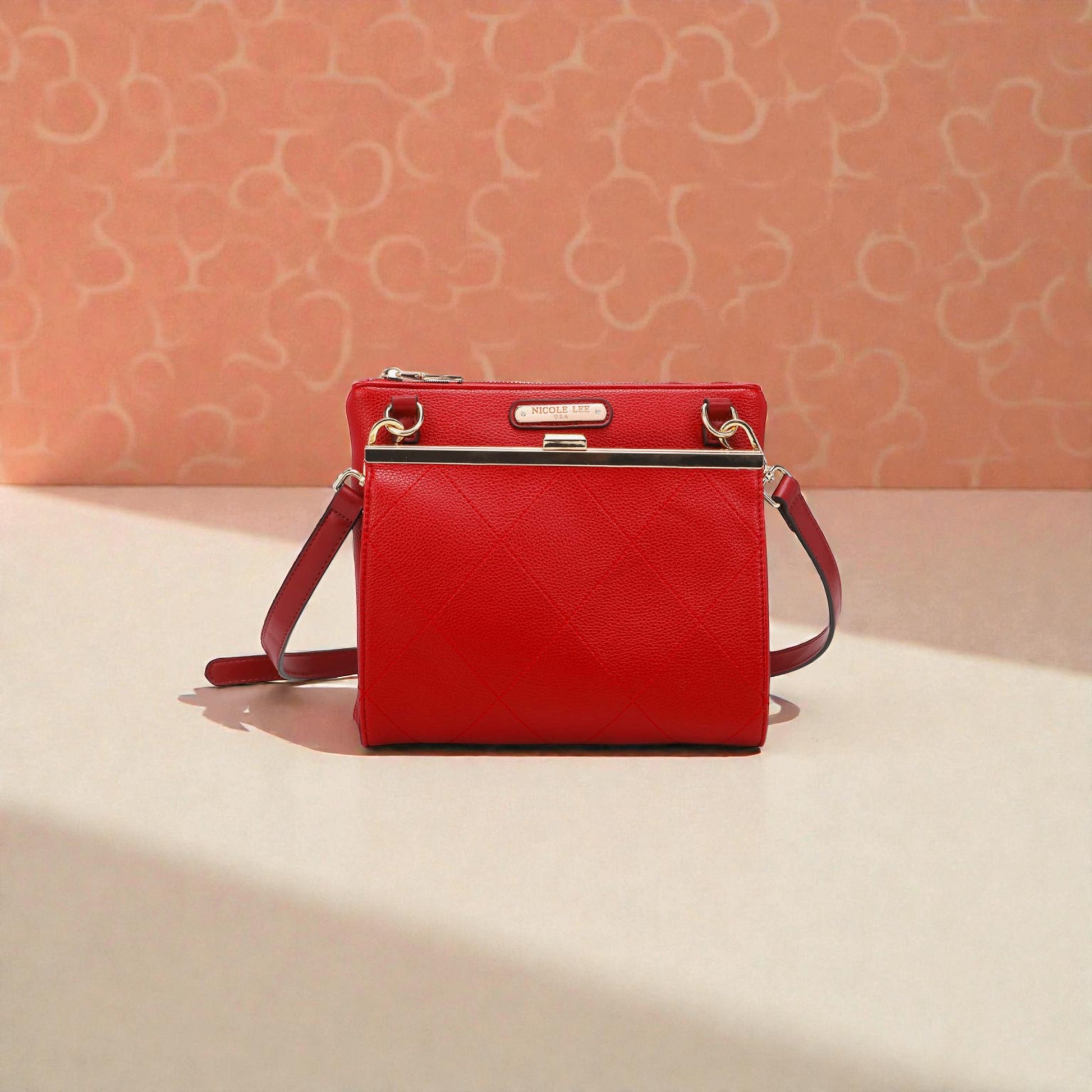 Red handbag on a light pink background