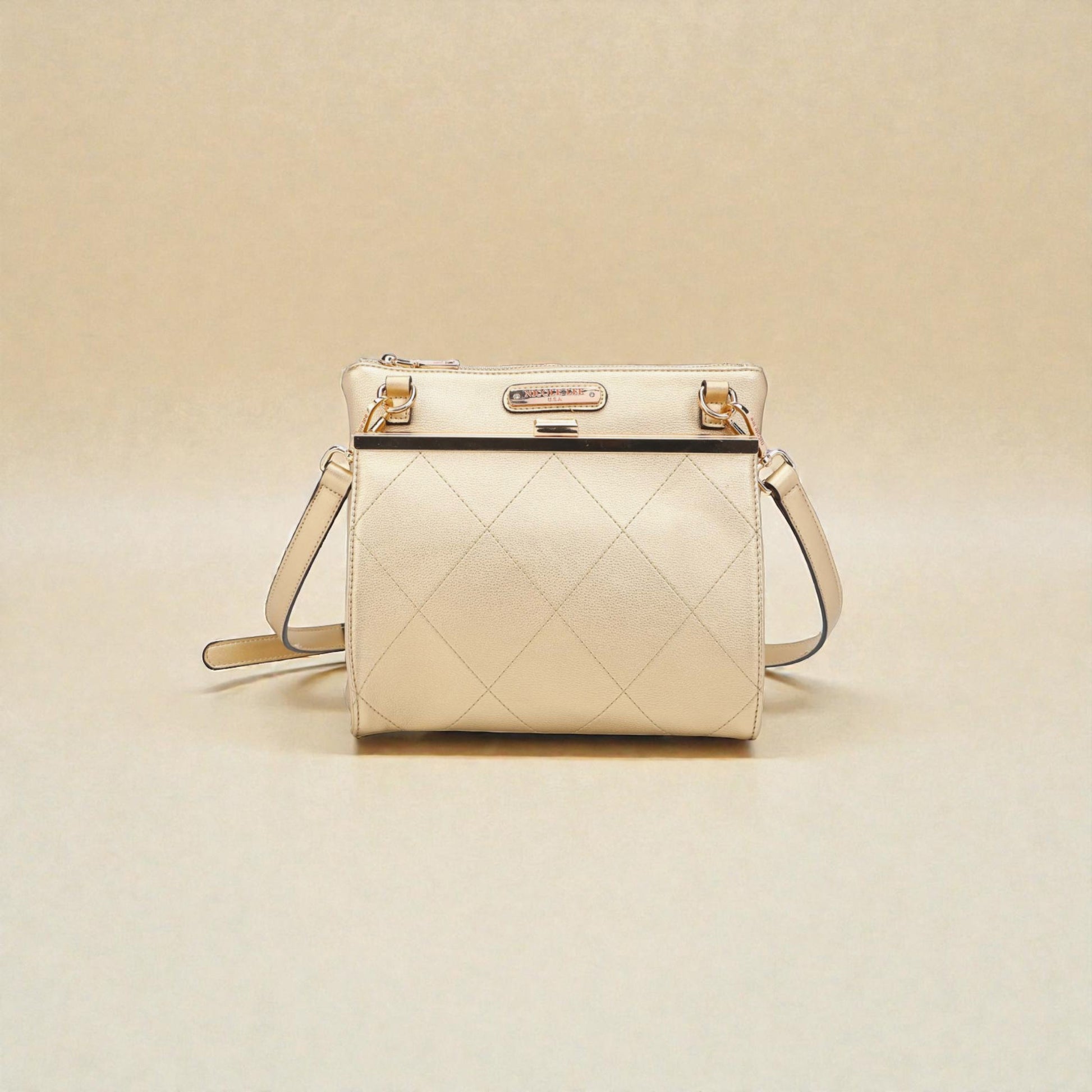 Beige quilted handbag on a beige background