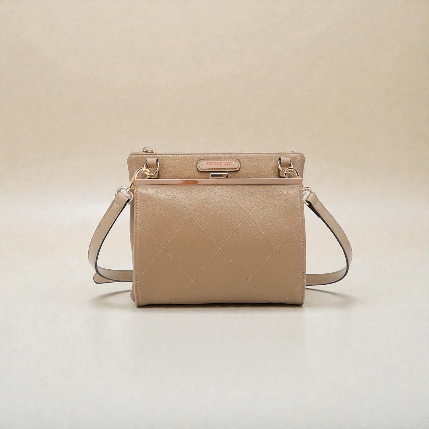 Beige handbag with a quilted pattern on a beige background