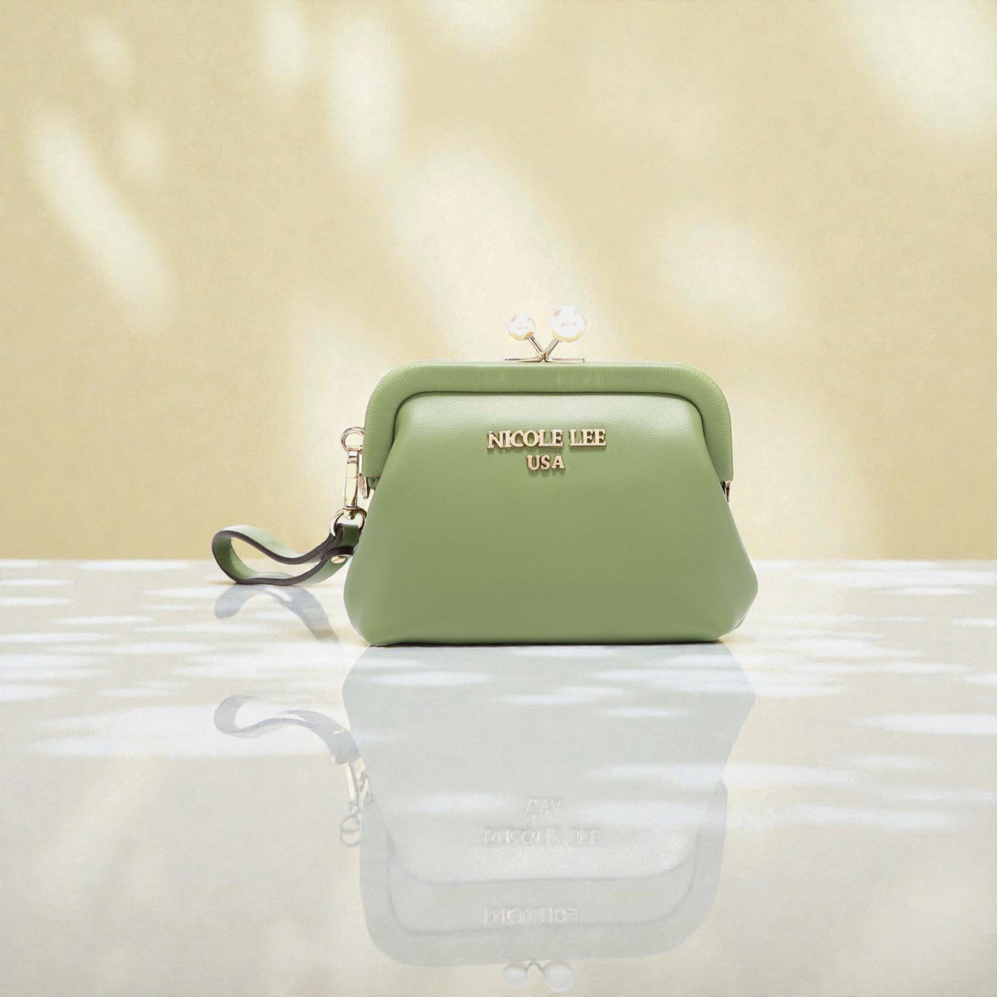 Green handbag with 'Nicole Lee' branding on a reflective surface with a beige background