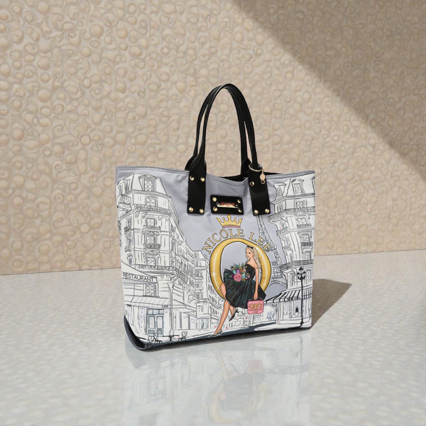 Handbag with a graphic design on a textured surface