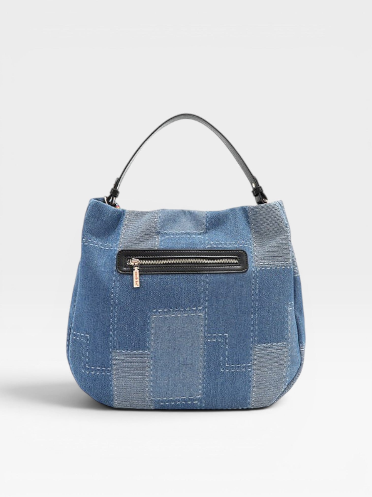 Blue patchwork handbag with a black zipper on a light gray background