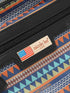 nicole lee bag with geometric pattern and American flag label