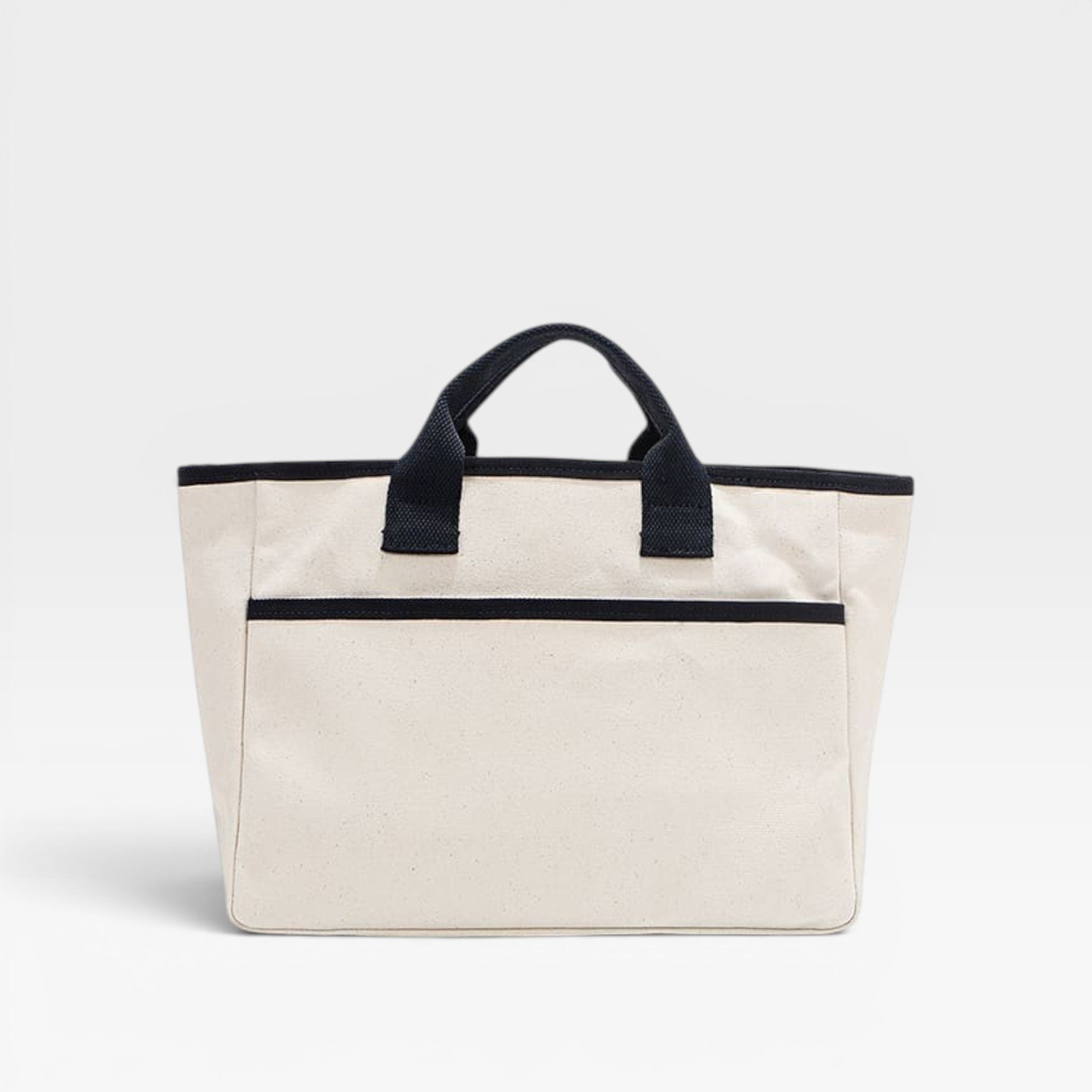 Beige tote bag with black handles and trim on a light gray background