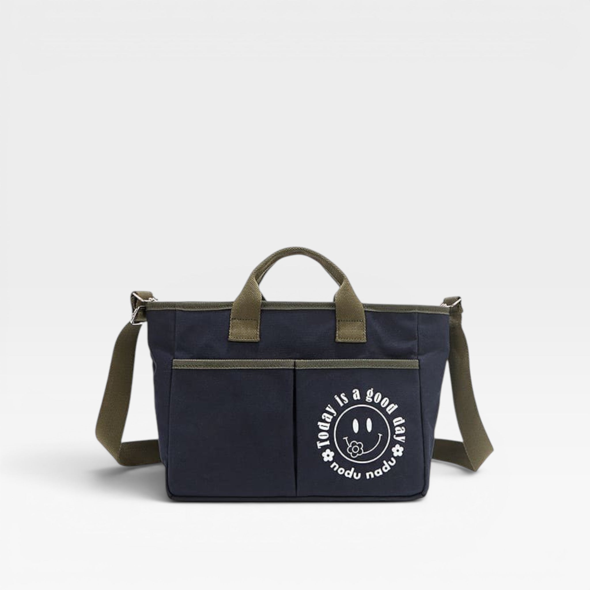 Navy blue bag with green straps and a smiley face logo on a white background