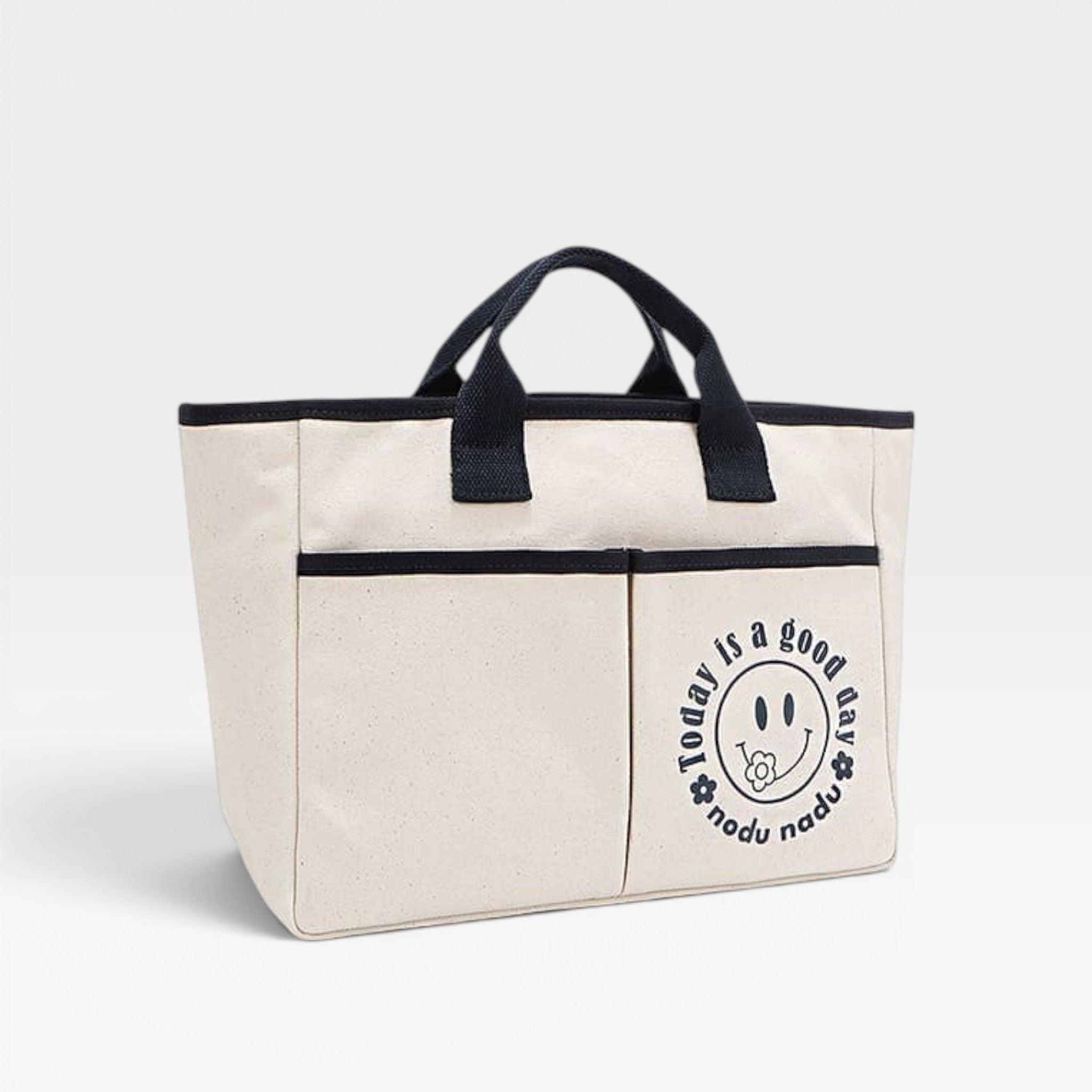 Beige tote bag with black handles and a circular logo on a white background