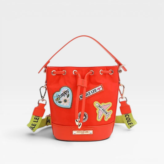 Red backpack with patches on a white background