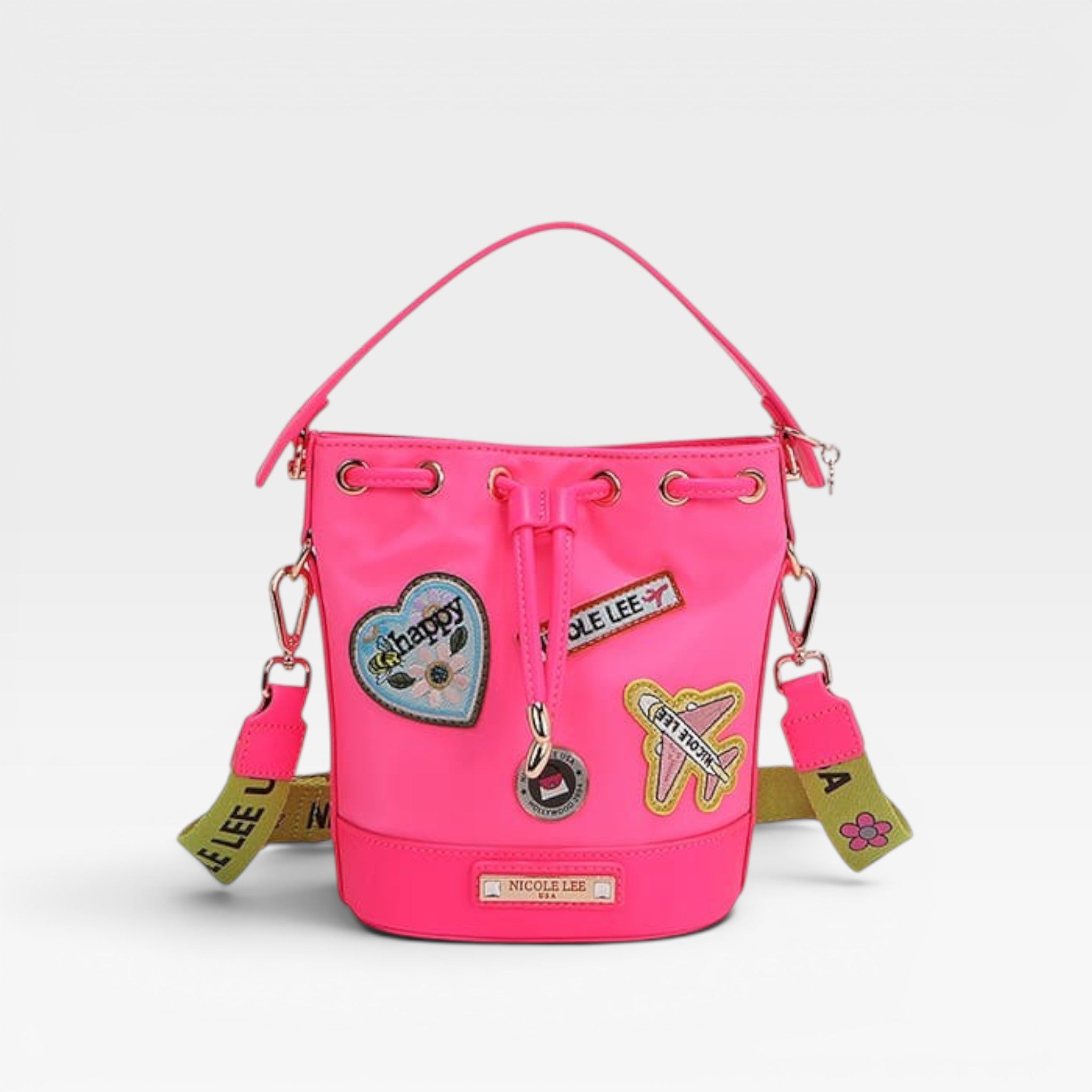 Pink backpack with patches and tags on a white background