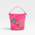 Pink bucket bag with patches on a light gray background