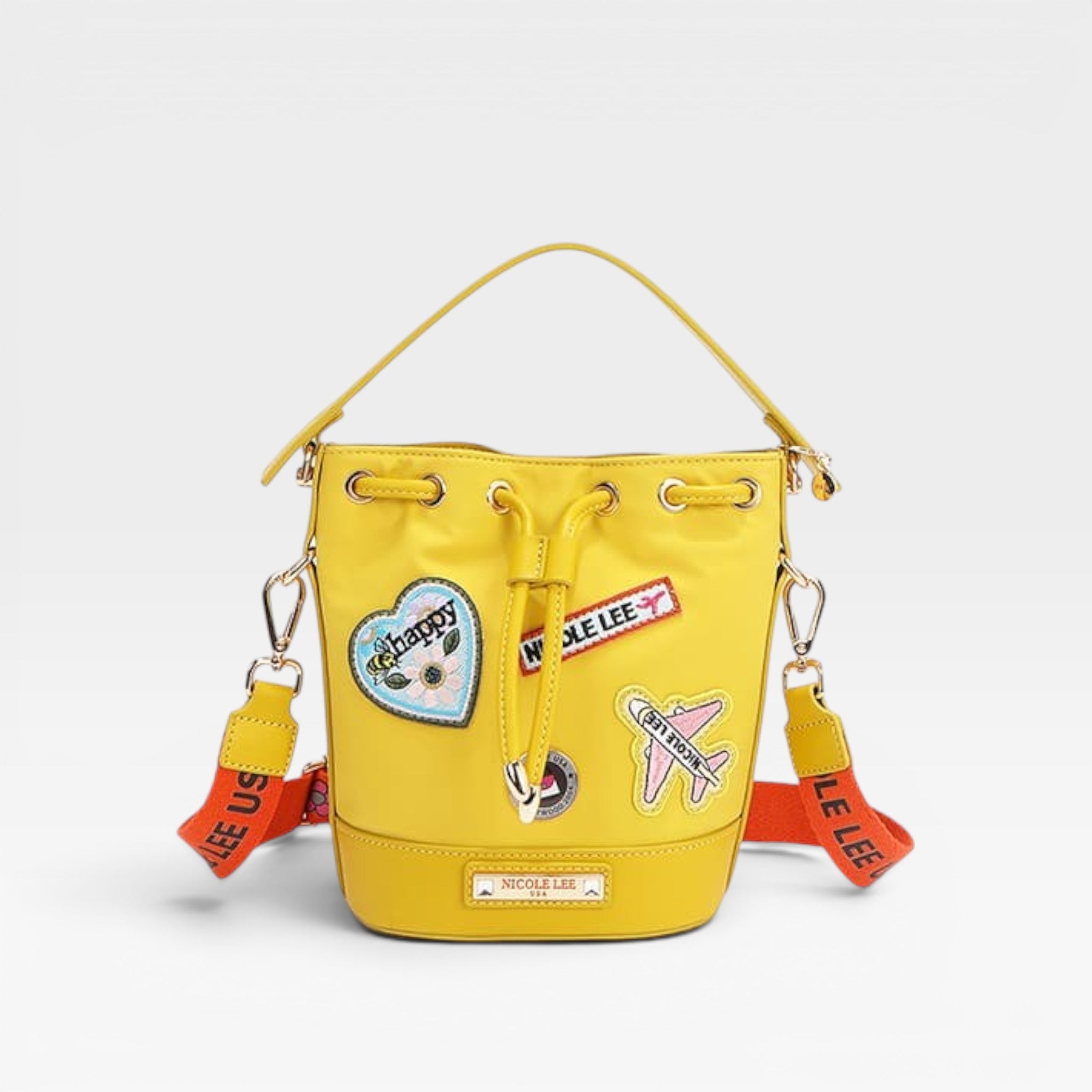 Yellow bucket bag with patches on a light gray background