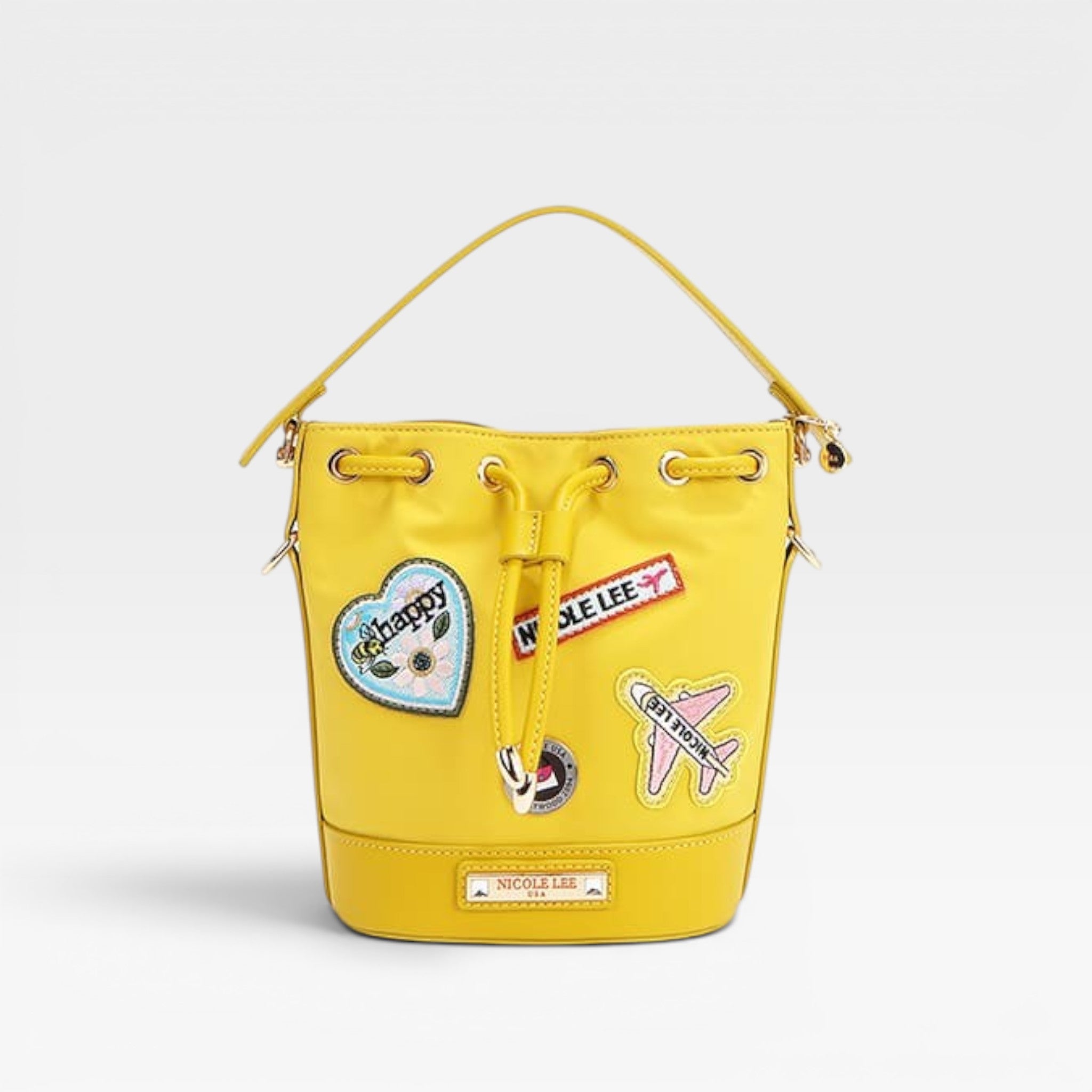 Yellow bucket bag with patches on a white background