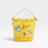 Yellow bucket bag with patches on a white background