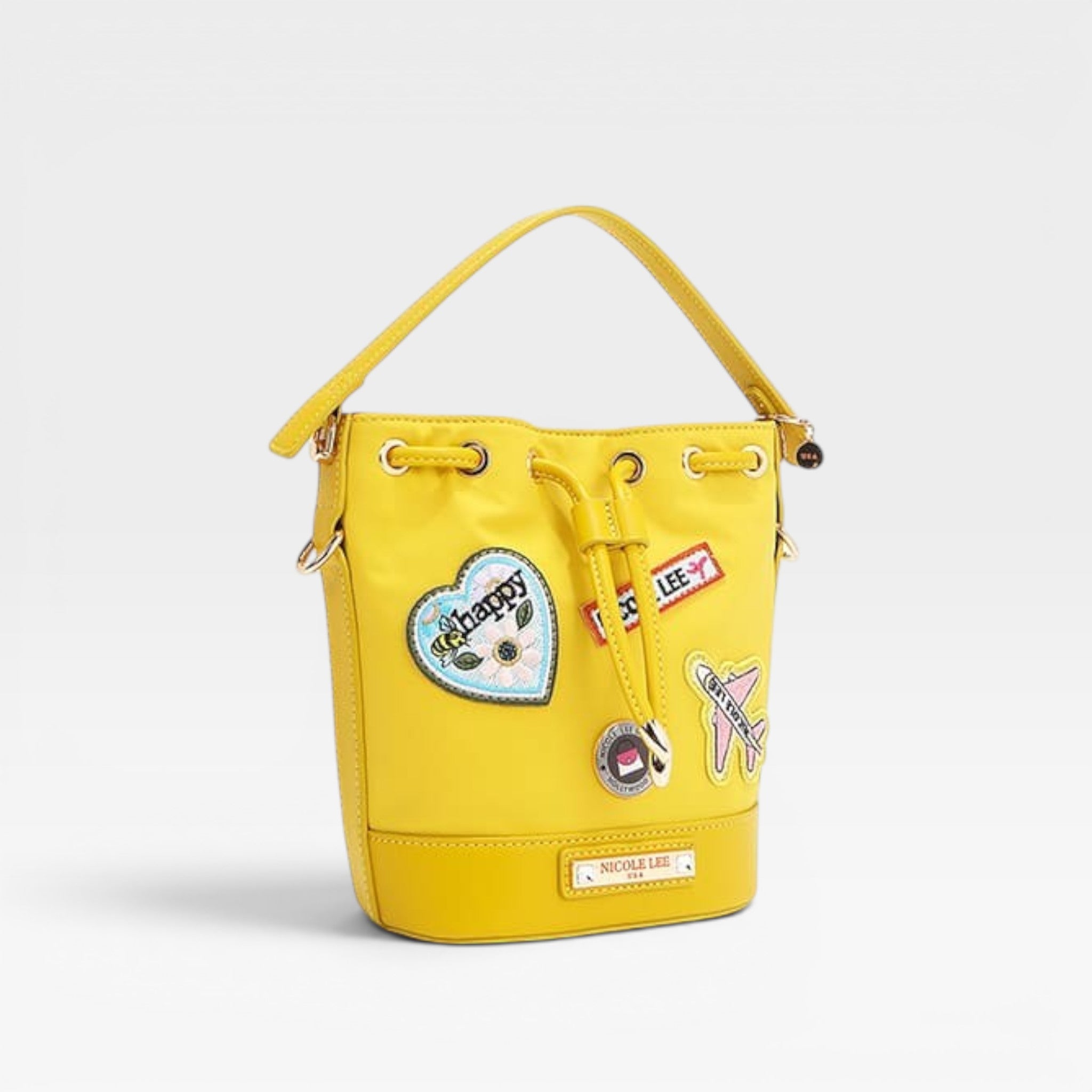 Yellow bucket bag with patches on a white background