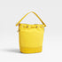 Yellow bucket bag on a light gray background