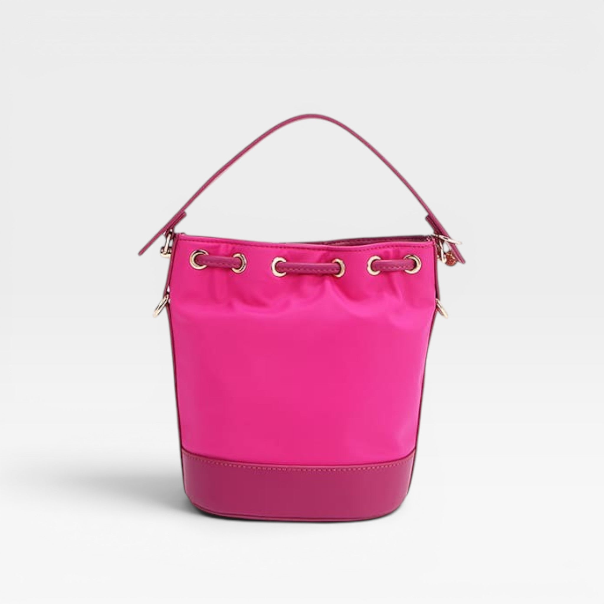 Pink bucket bag with gold accents on a light gray background