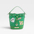 Green handbag with patches on a light gray background