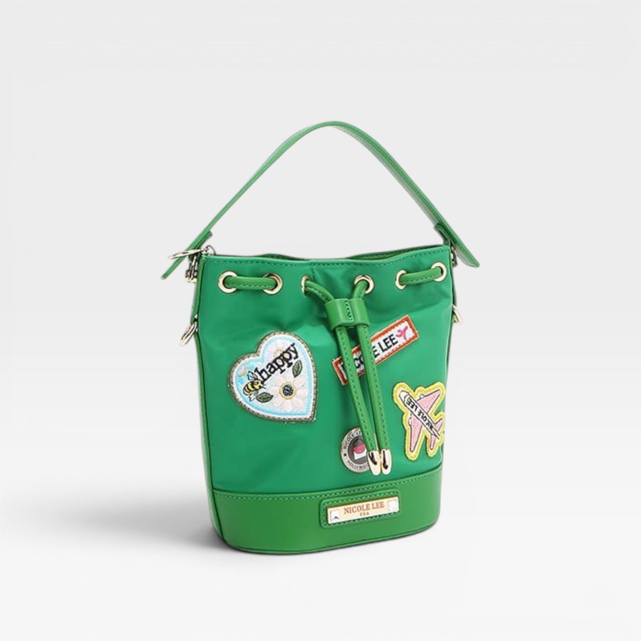 Green bucket bag with patches on a white background