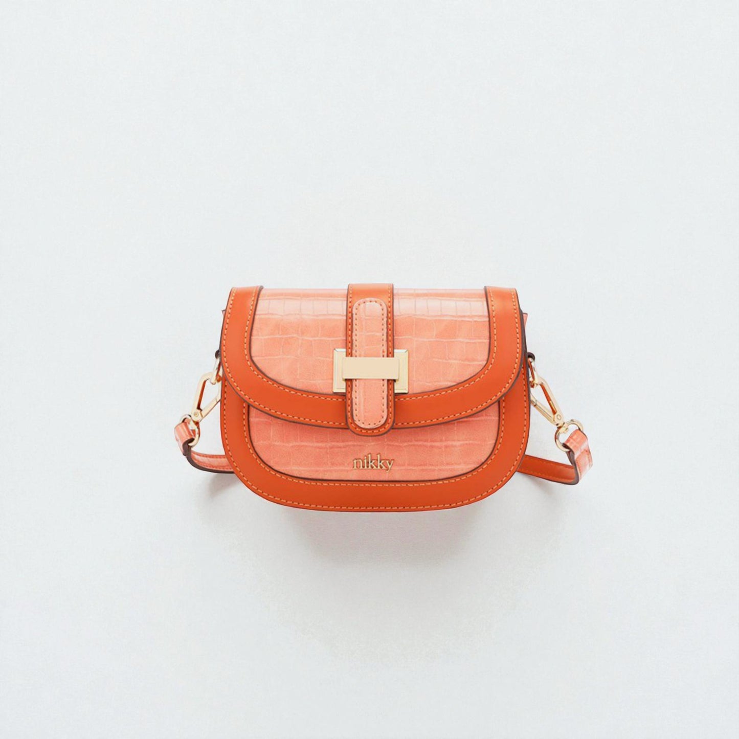 Orange handbag with gold clasp on a light gray background