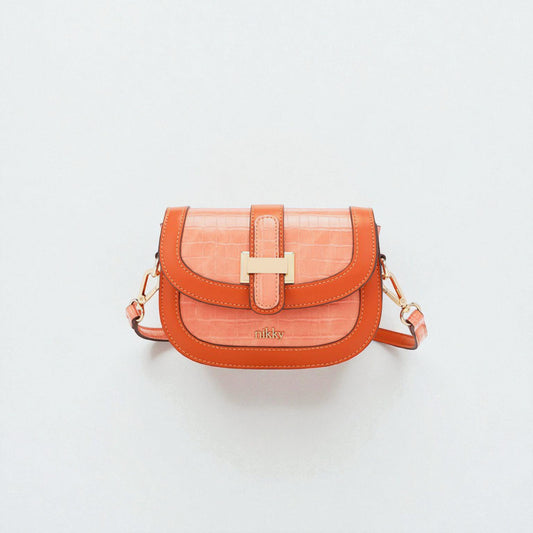 Orange handbag with gold clasp on a light gray background