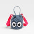 Small blue drawstring bag with cartoon eyes and pink straps on a light gray background