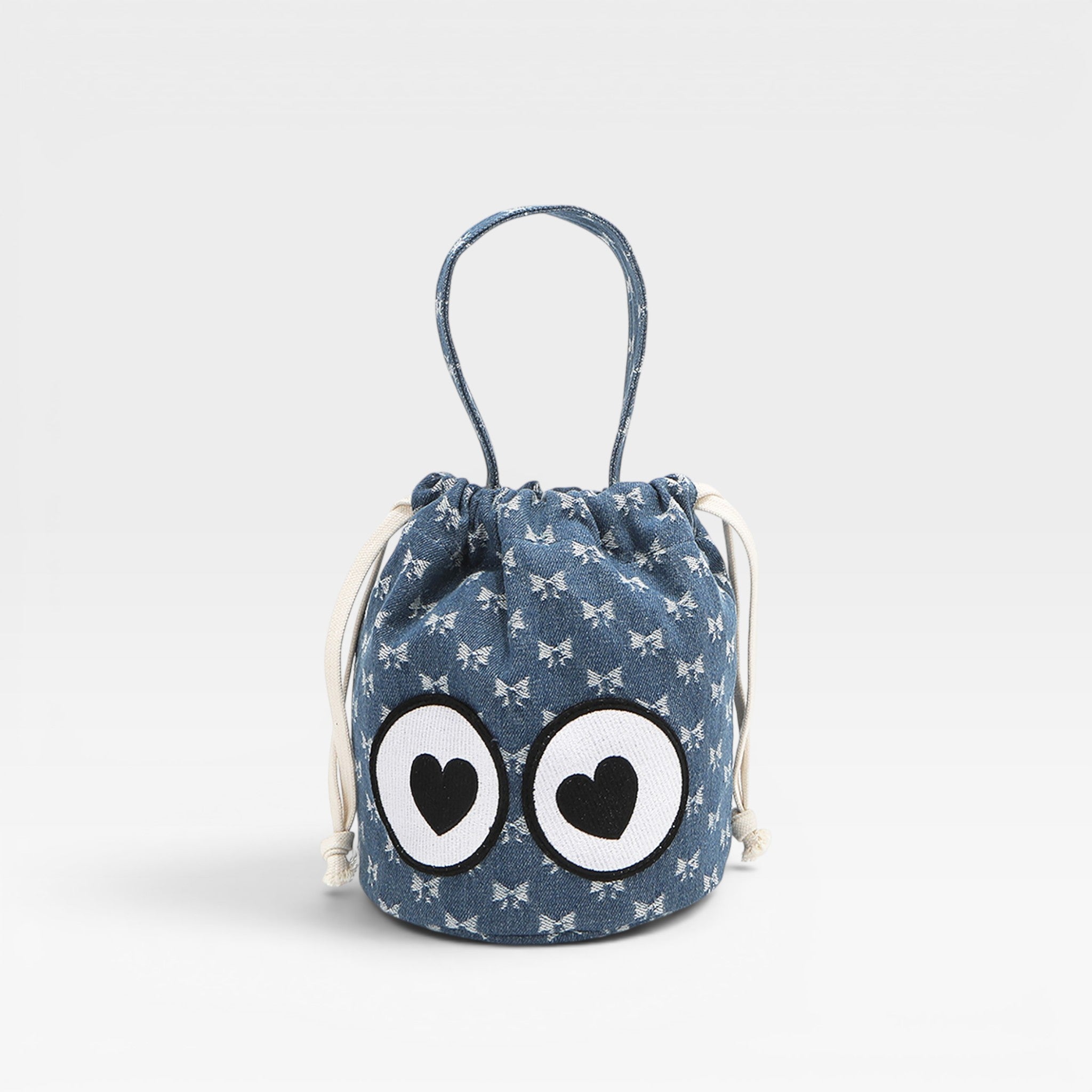 Blue drawstring bag with cartoon face on a light gray background