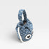 Blue fabric bag with white patterns and a heart design on a light gray background