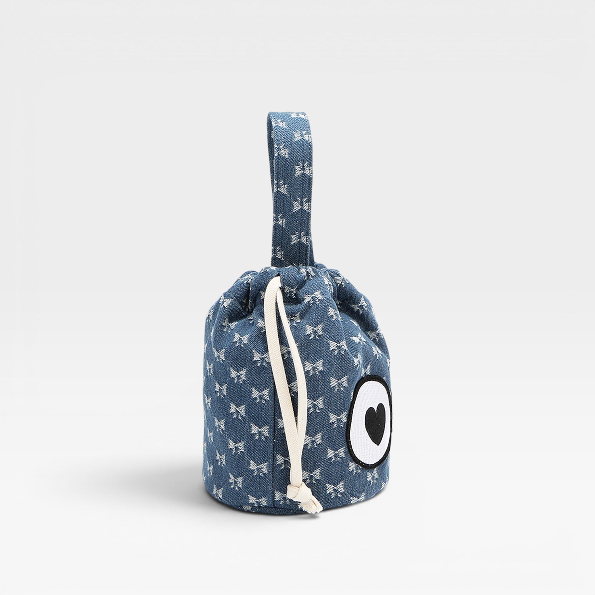Blue drawstring bag with white patterns and a black heart on a light gray background