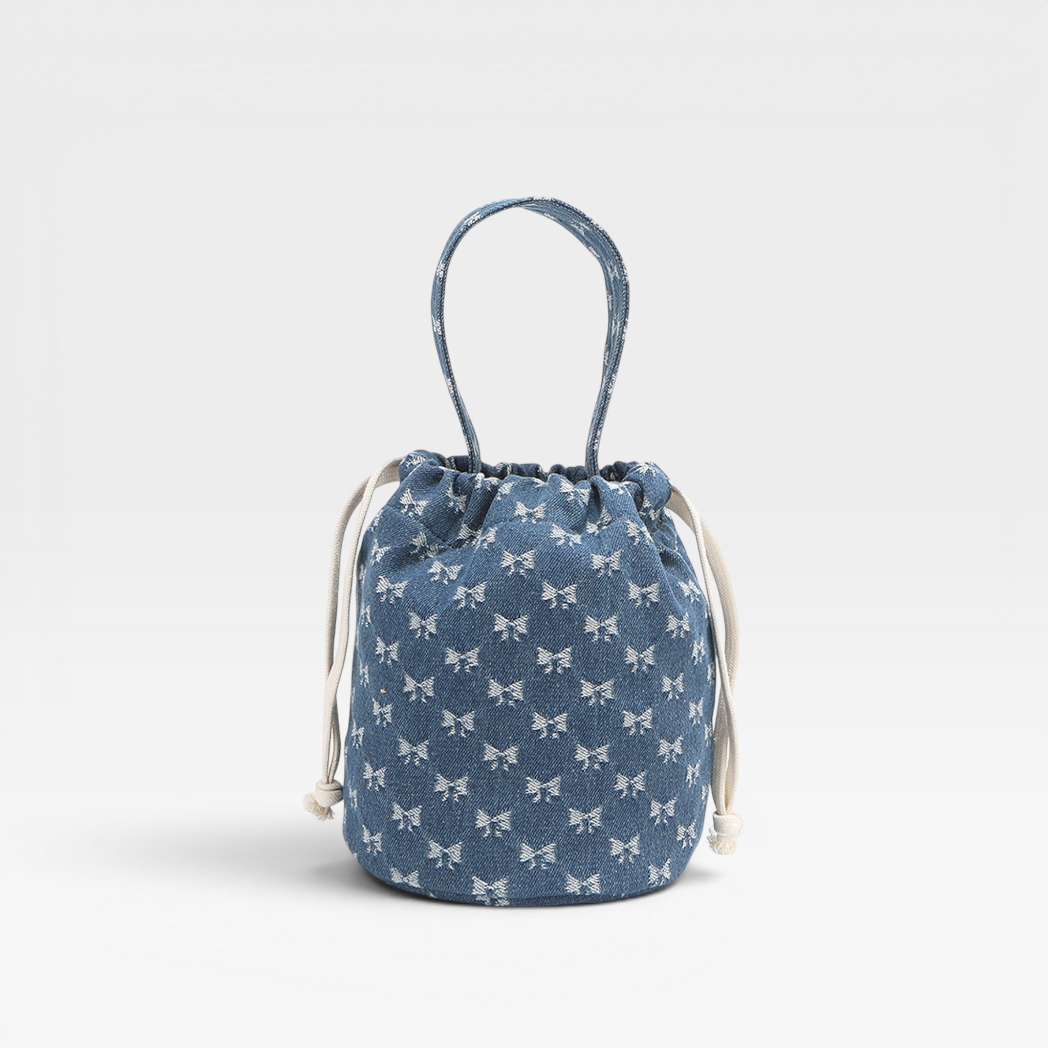 Blue drawstring bag with white patterns on a light gray background