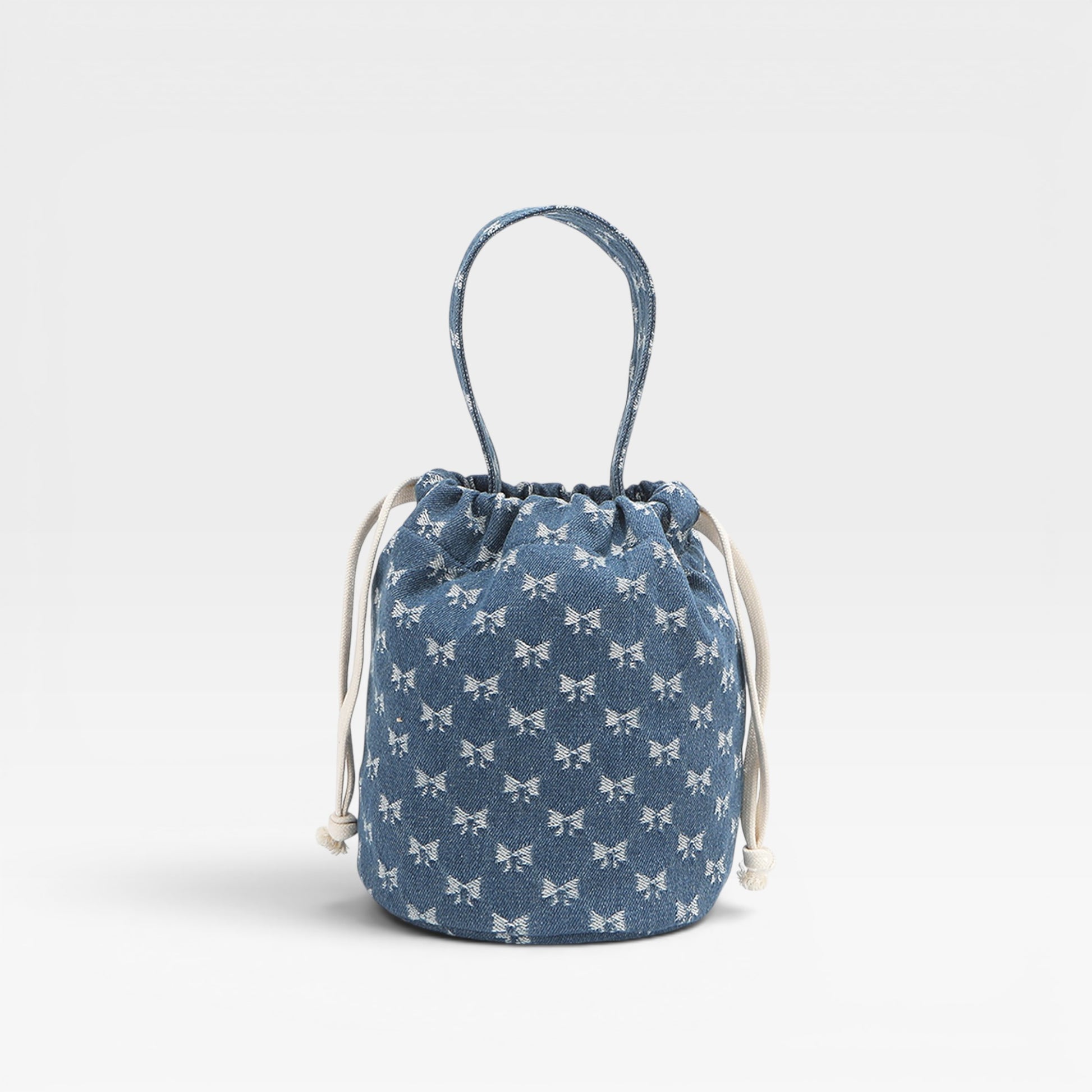 Blue drawstring bag with white patterns on a light gray background