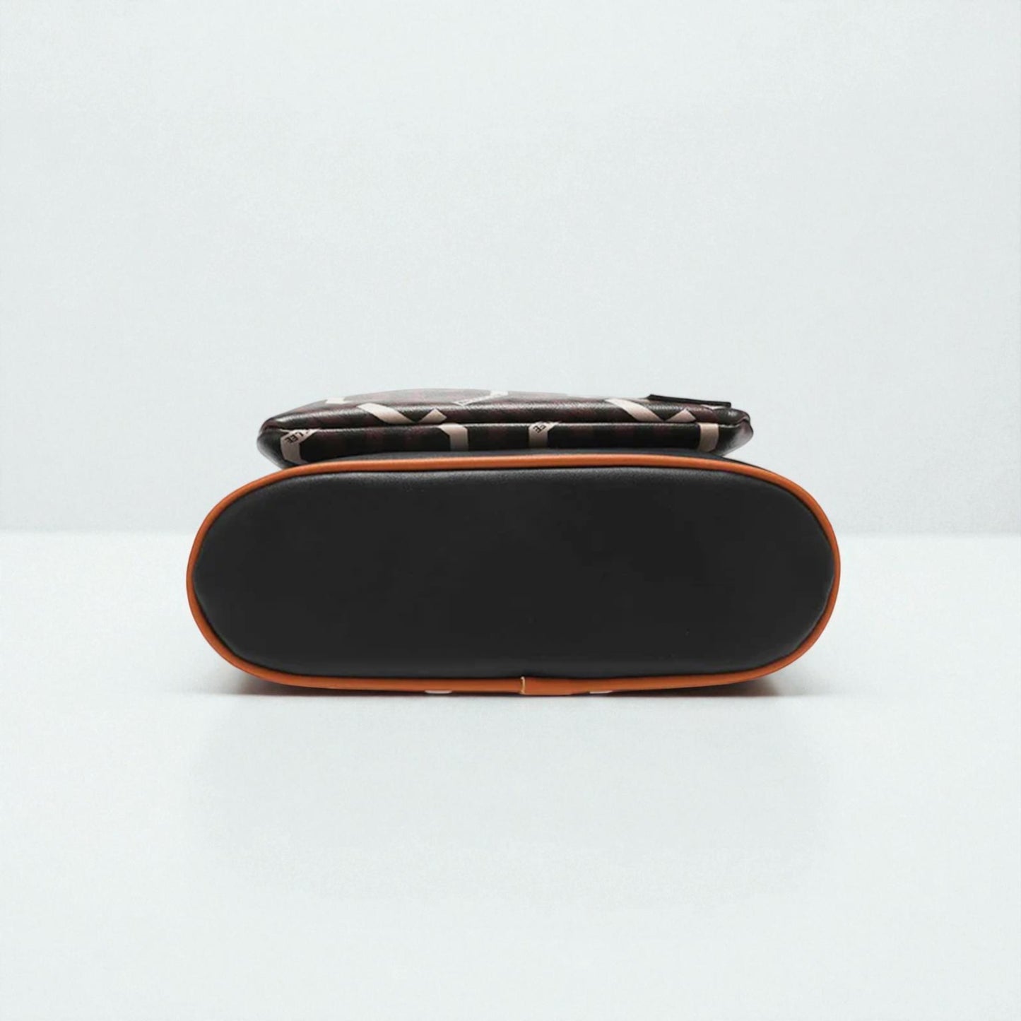 Black and brown rectangular pouch on a white background