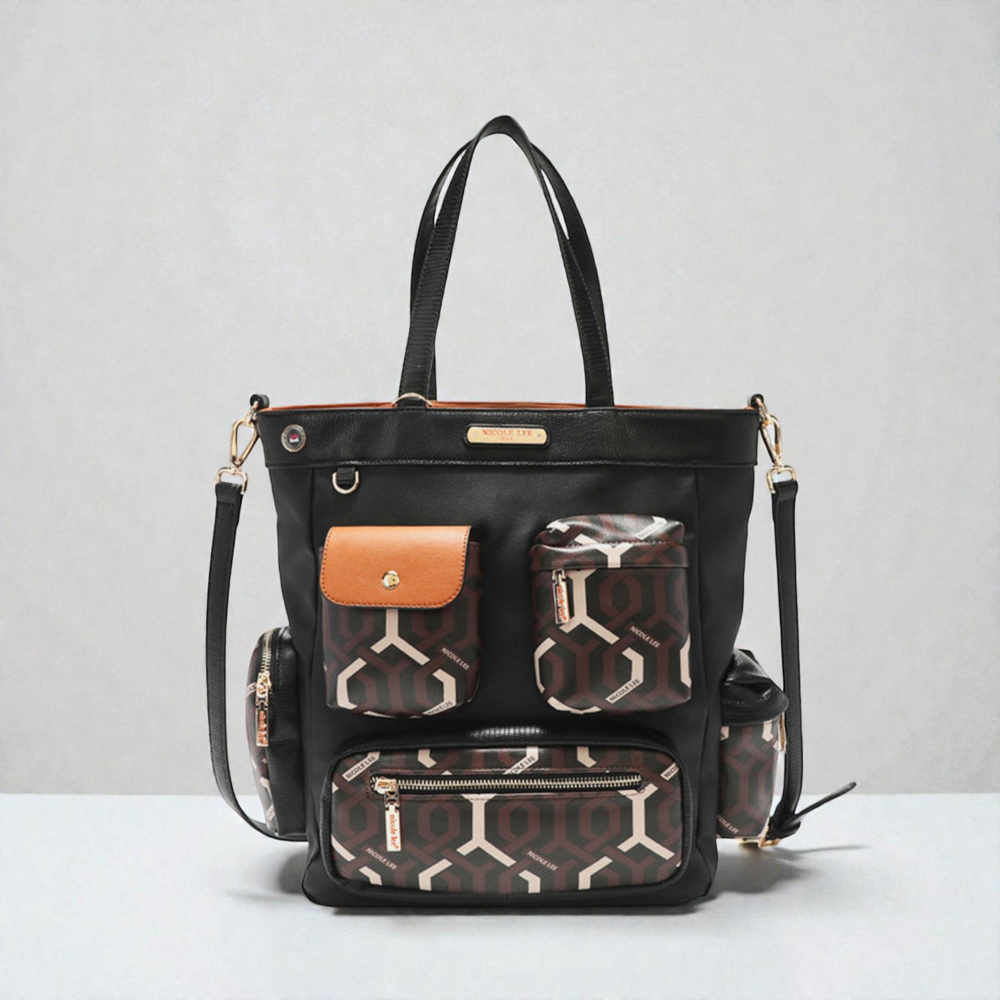 Black handbag with patterned pockets on a light gray background