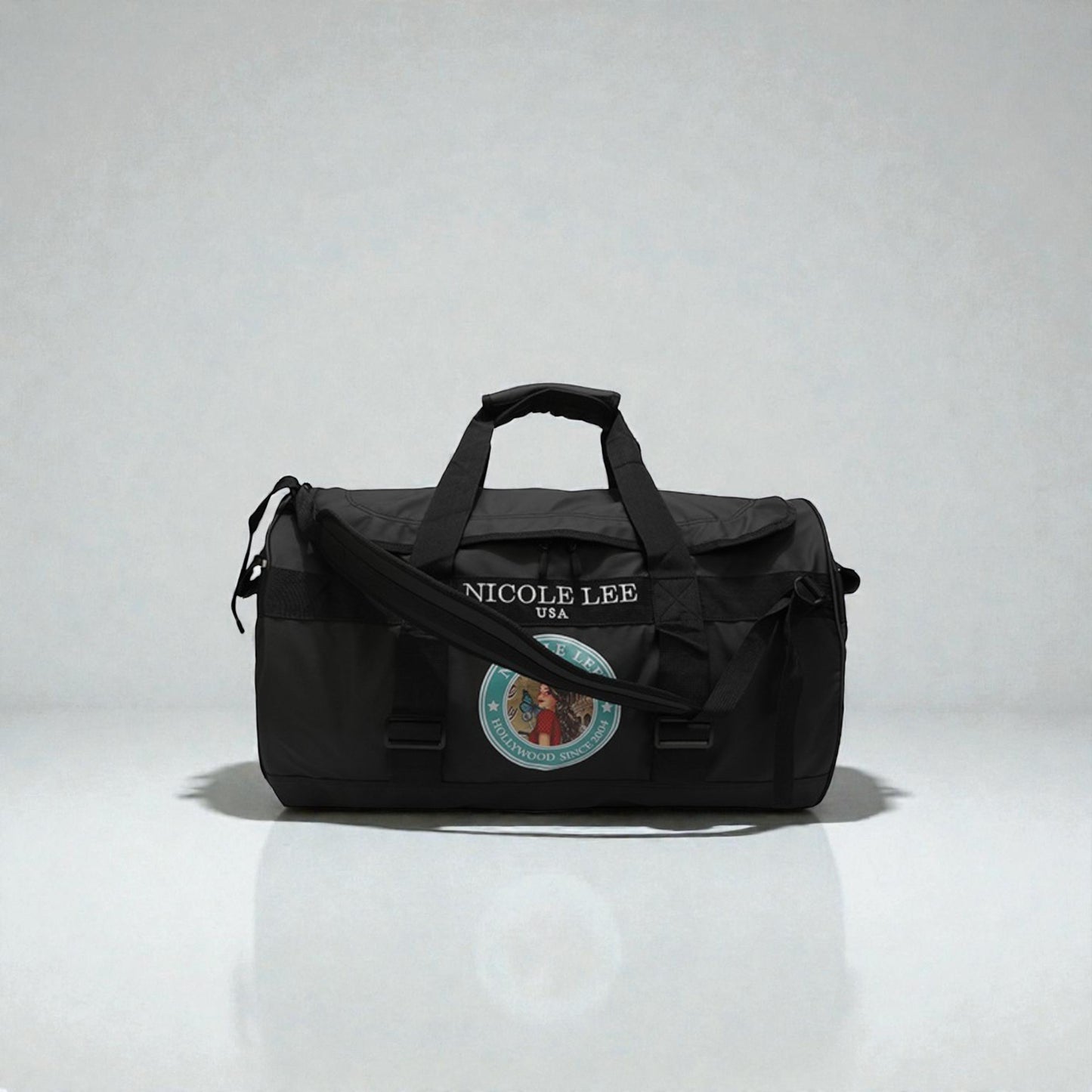 Black duffel bag with 'Nicole Lee' branding on a white background