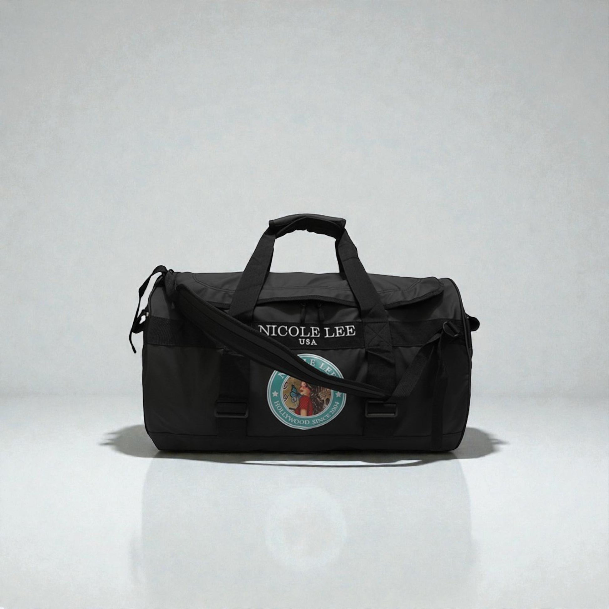 Black duffel bag with 'Nicole Lee' branding on a white background