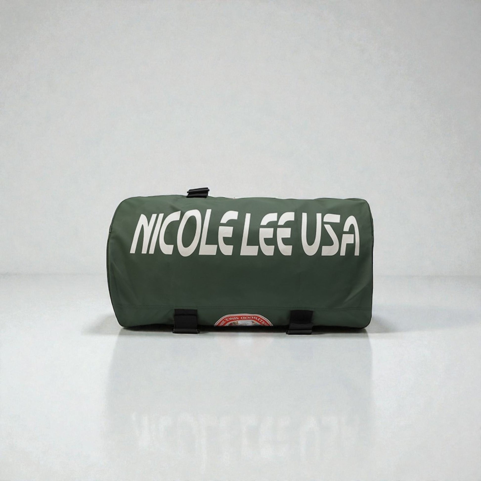 Green duffel bag with 'NICOLE LEE USA' text on a white background