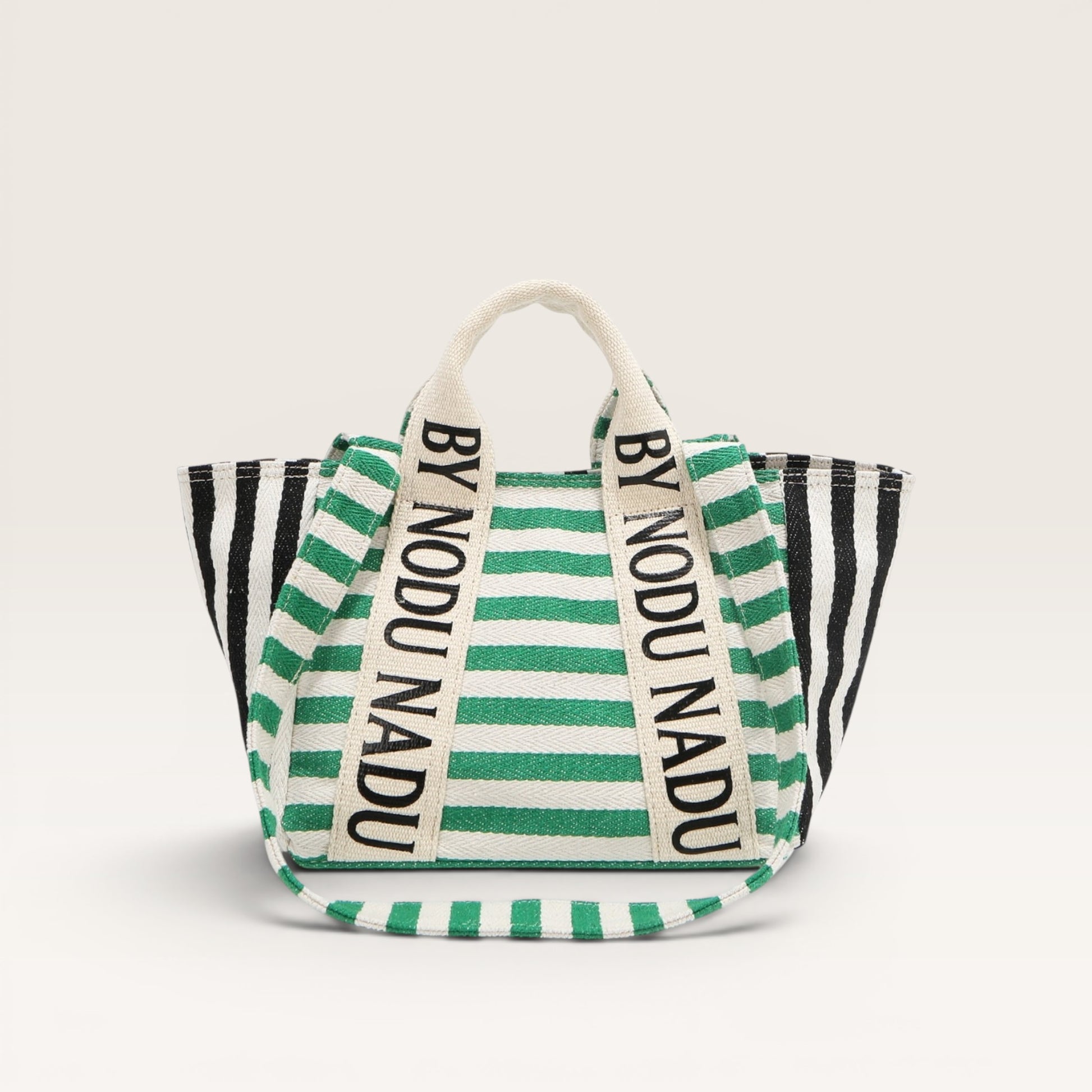 Striped bag with 'BY NODU NADU' branding on a white background
