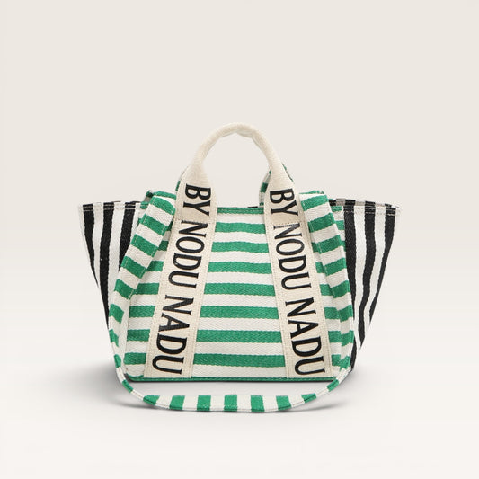 Striped bag with 'BY NODU NADU' branding on a white background