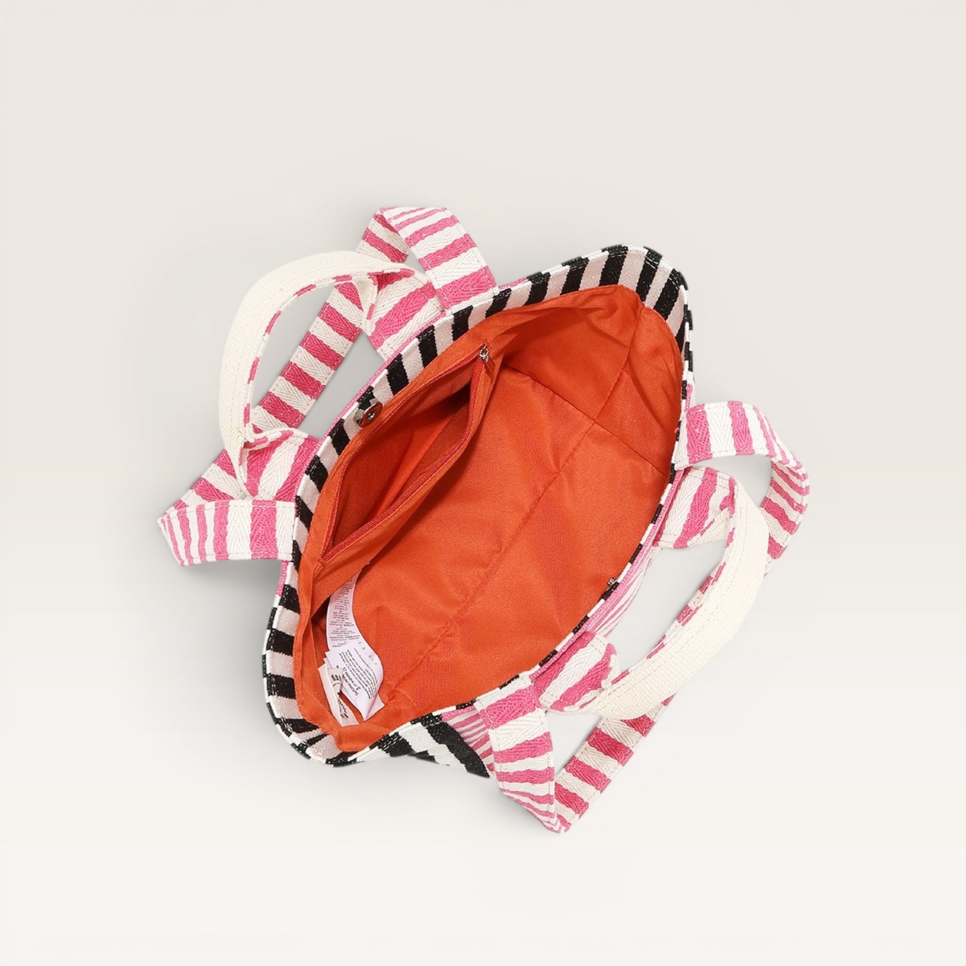 Backpack with pink and black striped design on a white background